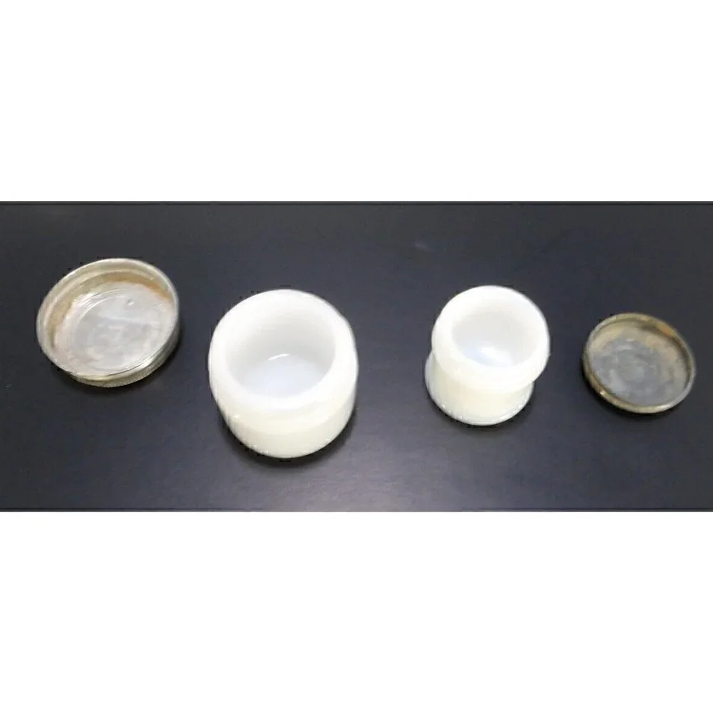 Two vintage tiny white glass makeup, face cream jars with screw on lids